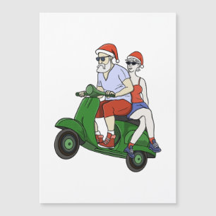 Santa and Mrs. Claus riding a scooter