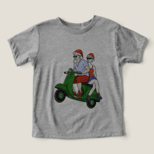 Santa and Mrs. Claus riding a scooter