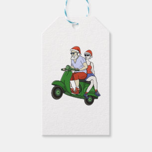 Santa and Mrs. Claus riding a scooter Gift Tags