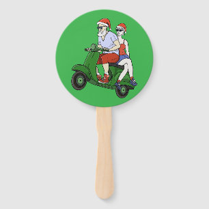 Santa and Mrs. Claus riding a scooter Hand Fan