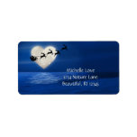Santa and Sleigh Heart Moon Christmas Address Label<br><div class="desc">This holiday Christmas address label features Santa,  His Sleigh and Reindeer flying past an enchanting heart shaped moon over a body of water with a snow covered beach. *</div>