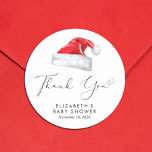 Santa Baby Christmas Baby Shower Thank You Classic Round Sticker<br><div class="desc">Cute stickers for your Christmas holiday season baby shower correspondence and party favours with "Thank You" in an elegant script with a heart swash and a watercolor illustration of a red Santa Claus hat. Personalise with the mother's name and shower date in simple modern typography.</div>