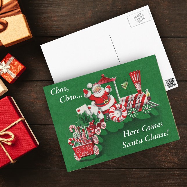 Santa Christmas Train Postcard (Santa Riding peppermint candy train with letters, candy canes on green Christmas postcard.)