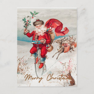 Santa Claus on a penny farthing with reindeer Holiday Postcard