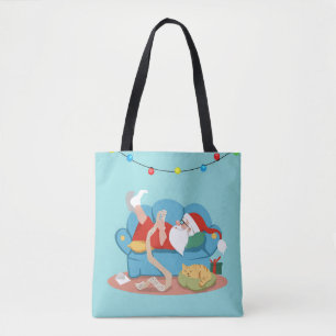 Santa Claus on the couch in pajamas Tote Bag