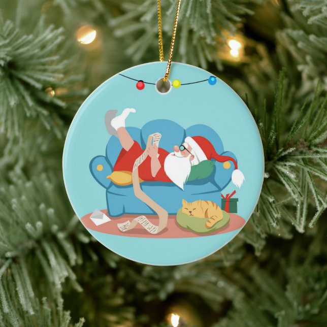 Santa Claus on the couch in pyjamas Ceramic Tree Decoration (Tree)