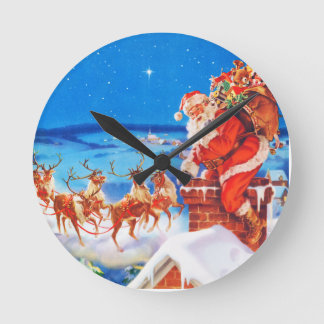 Santa Claus Up On The Rooftop In The Snow Round Clock