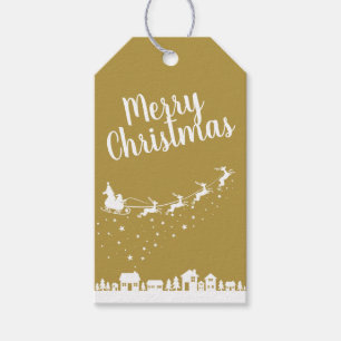 Santa Claus w/ sleigh & reindeers above the houses Gift Tags