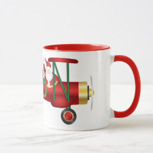 Santa Claus Waving on Biplane with Gifts Mug