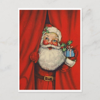 Santa Claus with a present behind curtain, vintage Postcard