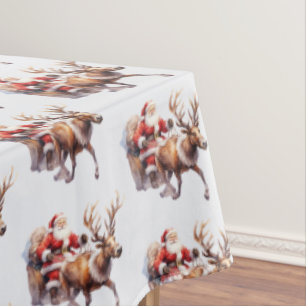 Santa Clause with a reindeer pulling his sleigh Tablecloth