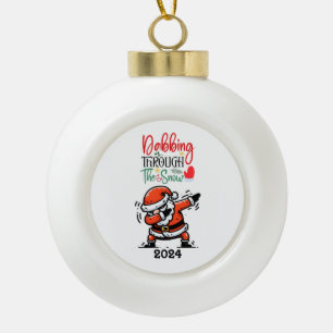 Santa Dabbing Through The Snow Ceramic Ball Christmas Ornament