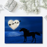 Santa, Heart Moon and Unicorn Beach Christmas Holiday Card<br><div class="desc">This holiday Christmas greeting card features a heart shaped full moon with Santa and his sleigh above a moon lit body of water. On the shore is a silhouette unicorn watching the holiday magic. Inside Greeting ~ "Wishing You a Magical Holiday Season Full of Love and Peace" The greeting can...</div>