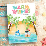 Santa Mermaid Beach Christmas Holiday Card<br><div class="desc">Tropical "Warm Wishes" Christmas card features Santa and a mermaid swimming in the ocean at sunset,  framed by a pair of palm trees decked out in string lights. Santa is sipping a cocktail out of a pineapple and flashing the Hawaiian aloha hang loose sign. Art by KL Stock.</div>