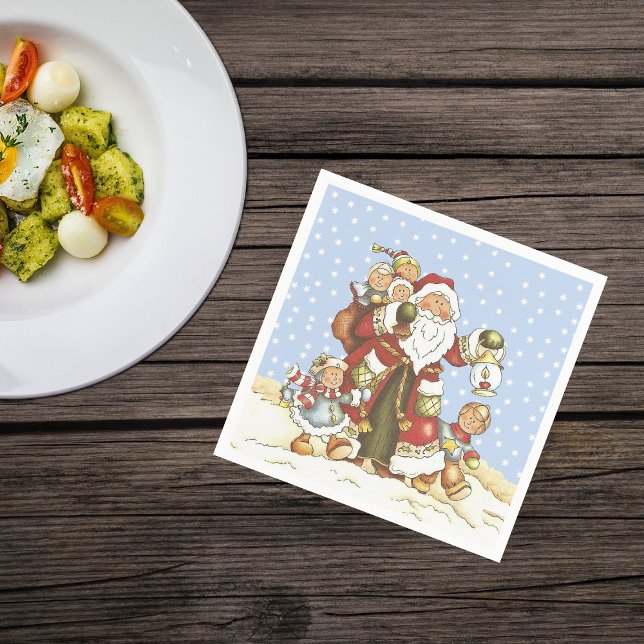 Santa With Lantern Children in Falling snow Napkin (Santa Claus with children walking in snow blue sky on Christmas napkins.)