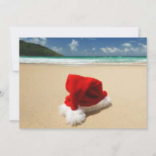 Santa's hat on a tropical beach holiday card