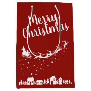 Santa's sleigh & reindeers flying above the houses medium gift bag