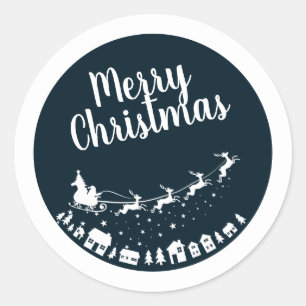 Santa's sleigh silhouette flying above the houses classic round sticker