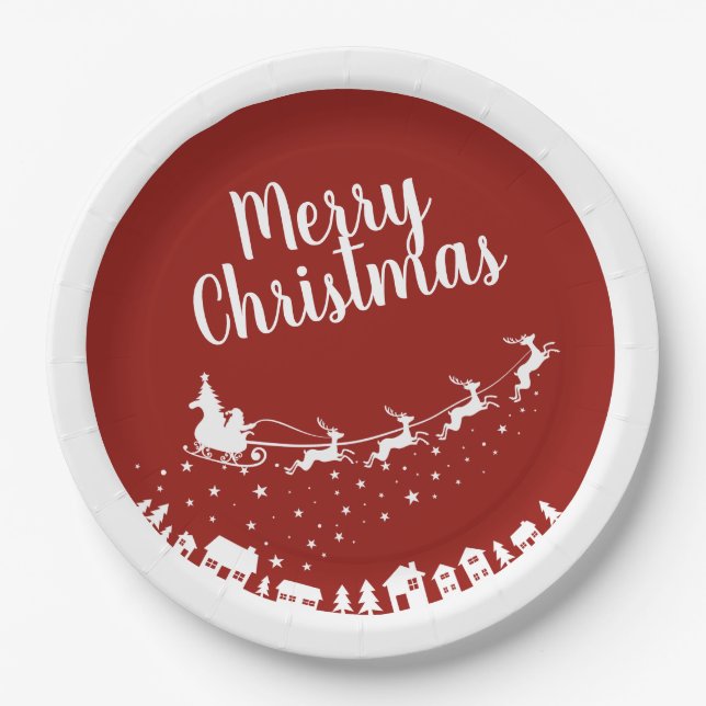 Santa's sleigh silhouette flying above the houses paper plate (Front)