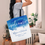 Sapphire Tide Personalised Wedding Welcome Tote Bag<br><div class="desc">Custom allover printed wedding welcome tote bags. The design features an abstract blue watercolor background and "Welcome" text in hand-lettered style script to coordinate with our Sapphire Tide collection. Personalise it with the bride and groom's names, wedding date and location or other custom text. Use the design tools to change...</div>