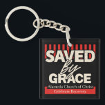 Saved by Grace Alamina Church of Christ key chain<br><div class="desc">"Saved by Grace" Keychain – Alameda Church of Christ Celebrate faith and strength with this inspiring "Saved by Grace" t-shirt, featuring 2 Corinthians 12:9: “My grace is sufficient for you, for my power is made perfect in weakness.” Perfect for members of Alameda Church of Christ or anyone wanting to share...</div>