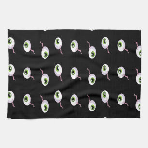 Scary eyeballs on black tea towel