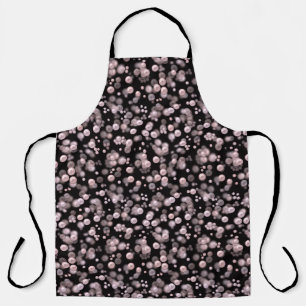 Scatterings of pink and white pearls on black velv apron