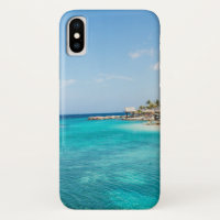 Scenic Tropical Beach with Thatched Huts Photo