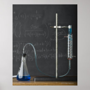 Science experiment in front of blackboard poster
