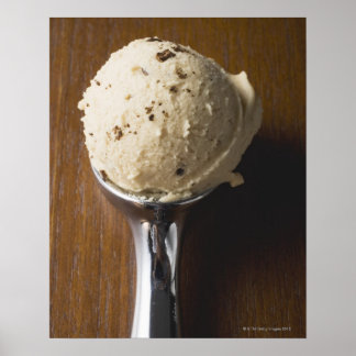 Scoop of ice cream in ice cream scoop (overhead poster
