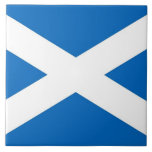 Scotland Flag Tile<br><div class="desc">Enhance your space with our striking tile featuring the flag of Scotland! Crafted with meticulous attention to detail, this tile is more than just a decorative piece; it's a celebration of Scottish heritage and national pride. The bold design proudly showcases the iconic elements of the Scottish flag, including the white...</div>