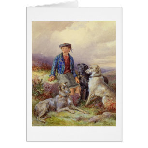 Scottish boy with wolfhounds in a Highland landsca