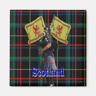 Scottish piper on tartan magnet