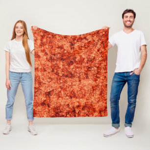 Scratches on a lightly spotted coral background fleece blanket