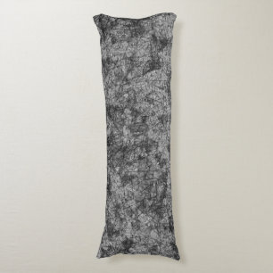 Scratches on a lightly spotted grey to black body cushion
