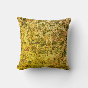 Scratches on scratches on a lightly spotted ochre cushion