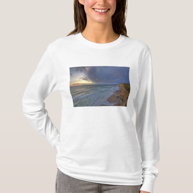 Sea cliffs catch days last light at Pomponi T-Shirt (Front)