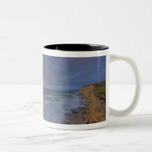 Sea cliffs catch days last light at Pomponi Two-Tone Coffee Mug