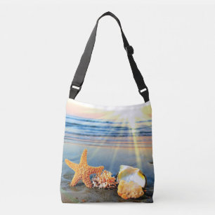 Sea shells and starfish on beach crossbody bag