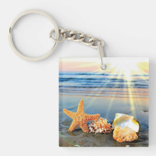 Sea shells and starfish on beach key ring