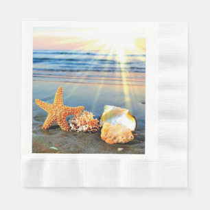 Sea shells and starfish on beach napkin