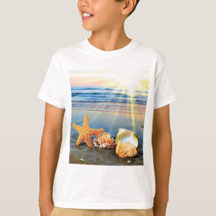 Sea shells and starfish on beach T-Shirt