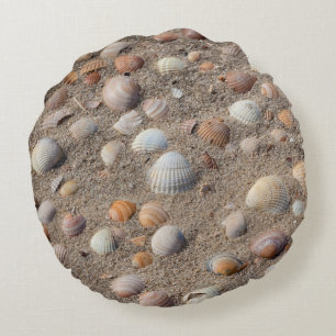 Sea shells at the beach round cushion