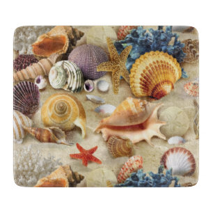 Sea shells on beach cutting board