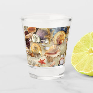 Sea shells on beach shot glass