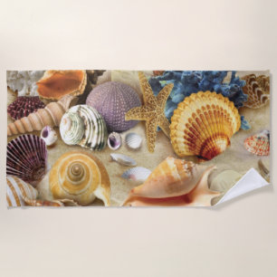 Sea shells on beach towel