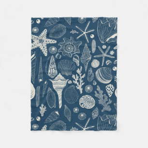 Sea shells on dark blue fleece blanket