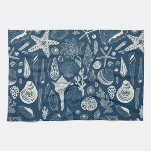 Sea shells on  dark blue tea towel