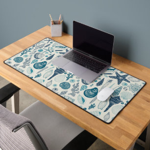 Sea shells on off white desk mat