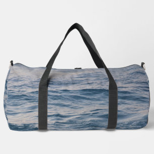 Sea water closeup  duffle bag